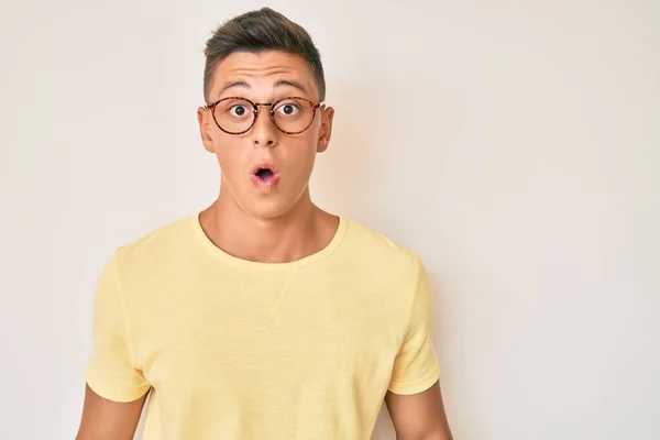 Young Hispanic Boy Wearing Casual Clothes Glasses Scared Amazed Open — Stock fotografie