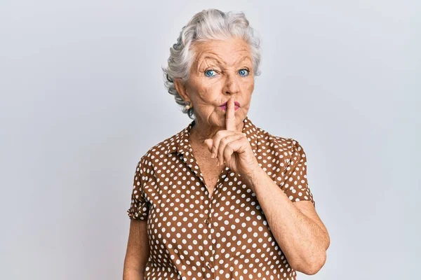 Senior Grey Haired Woman Wearing Casual Clothes Asking Quiet Finger Stock Image