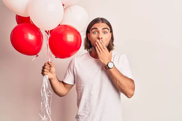 Young Handsome Man Holding Balloons Covering Mouth Hand Shocked Afraid — Stock Photo, Image