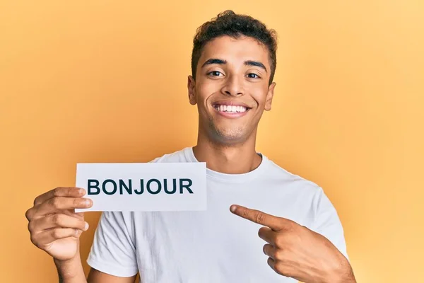 Young Handsome African American Man Holding Bonjour French Greeting Word — ストック写真