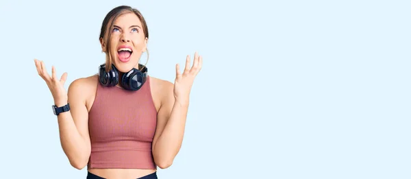 Beautiful Caucasian Young Woman Wearing Gym Clothes Using Headphones Crazy — Stock Photo, Image