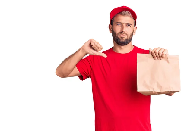 Young Handsome Blond Man Holding Delivery Paper Bag Angry Face — Stock Photo, Image