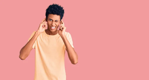 Young African American Man Wearing Casual Clothes Covering Ears Fingers — Stock Photo, Image