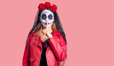 Woman wearing day of the dead costume over background asking to be quiet with finger on lips. silence and secret concept.  clipart