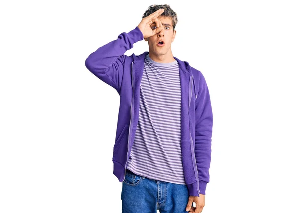 Young Handsome Man Wearing Casual Purple Sweatshirt Doing Gesture Shocked —  Fotos de Stock