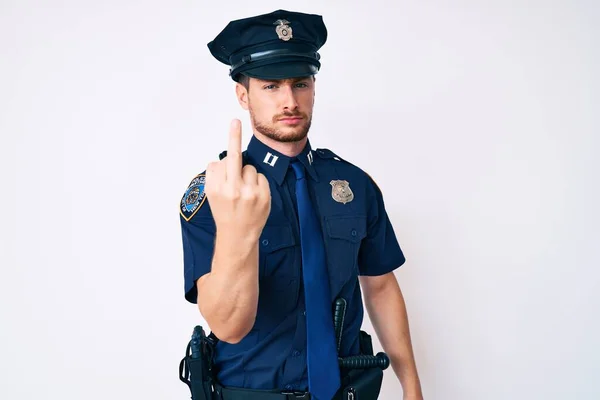 Young Caucasian Man Wearing Police Uniform Showing Middle Finger Impolite — Stok fotoğraf