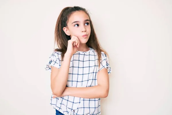 Cute Hispanic Child Girl Wearing Casual Clothes Serious Face Thinking — Stock Photo, Image