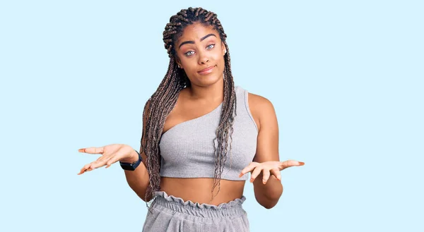 Young African American Woman Braids Wearing Sportswear Clueless Confused Expression —  Fotos de Stock
