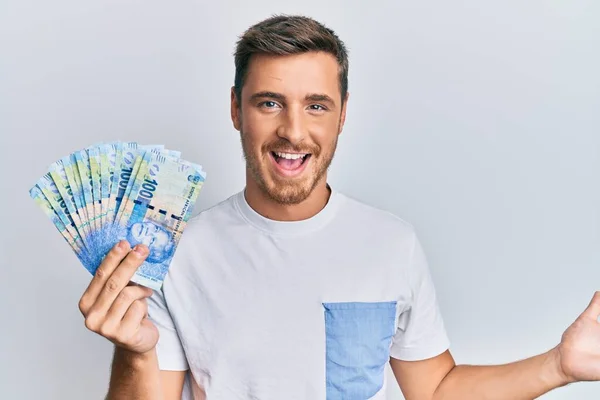 Handsome Caucasian Man Holding South African Rand Banknotes Celebrating Achievement —  Fotos de Stock