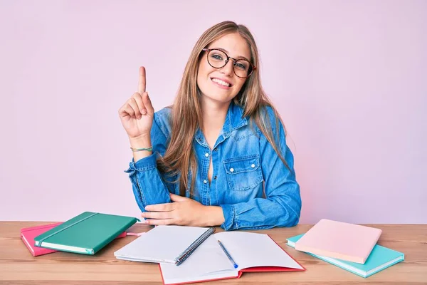 Young Blonde Girl Studying Sitting Table Smiling Idea Question Pointing — Stock Photo, Image