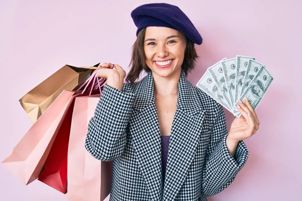 Young Beautiful Woman Wearing Beret Holding Shopping Bags Dollars Banknotes — 图库照片