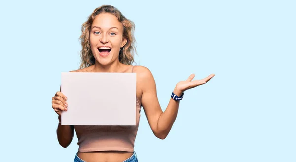 Beautiful Caucasian Woman Holding Blank Empty Banner Celebrating Victory Happy — Stock Photo, Image