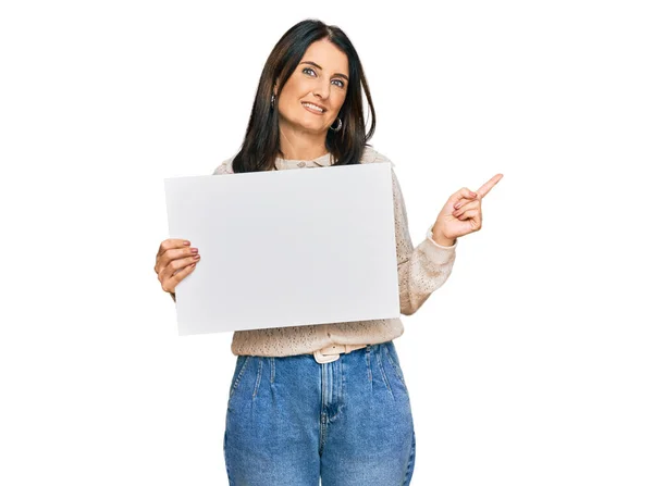 Middle Age Brunette Woman Holding Blank Empty Banner Smiling Happy — Stock Photo, Image