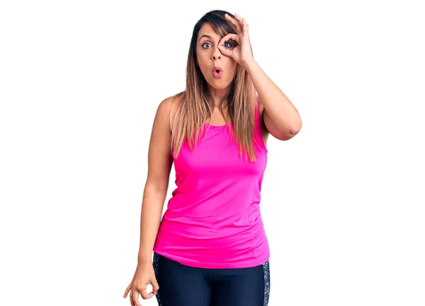 Young Beautiful Woman Wearing Sportswear Doing Gesture Shocked Surprised Face — Stock Photo, Image