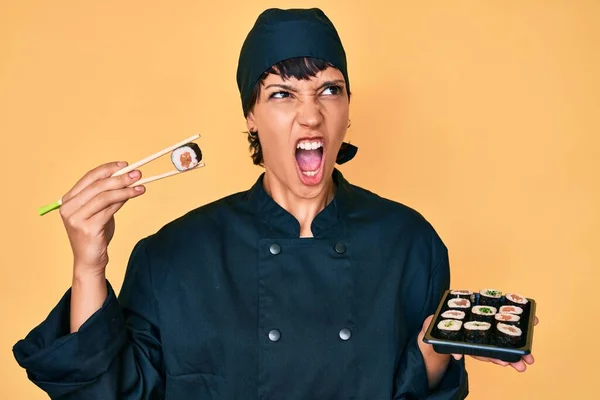 Beautiful Brunettte Woman Chef Holding Sushi Using Chopsticks Angry Mad — Stock Photo, Image