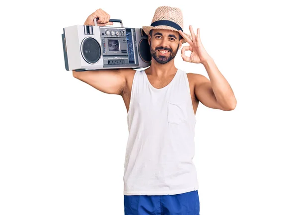 Young Hispanic Man Holding Boombox Listening Music Doing Sign Fingers — Stock Photo, Image