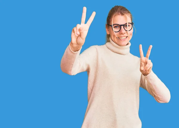 Young Beautiful Blonde Woman Wearing Turtleneck Sweater Glasses Smiling Looking — Stock Photo, Image