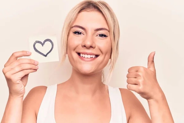 Young Beautiful Blonde Woman Holding Reminder Paper Heart Shape White — 스톡 사진