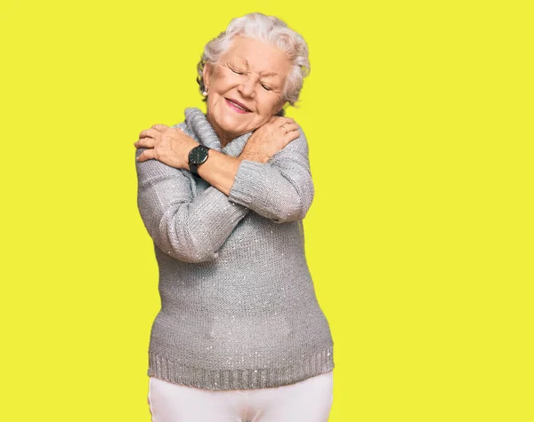 Senior Grey Haired Woman Wearing Casual Winter Sweater Hugging Oneself —  Fotos de Stock