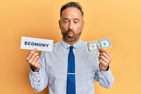 Handsome Middle Age Man Holding Economy Message Holding Dollar Making — Stok fotoğraf