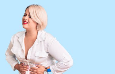 Sarışın, iri yarı, elleri karnında, rahat bir gömlek giyen genç bir kadın. Çünkü mide bulantısı, acı verici bir hastalık kendini iyi hissetmiyor. Ağrı kavramı. 