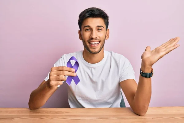 Young Handsome Man Holding Purple Ribbon Awareness Celebrating Victory Happy — Stock Photo, Image