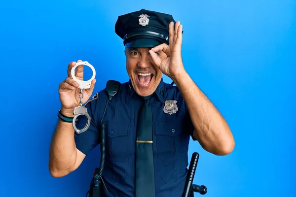 Handsome Middle Age Mature Man Wearing Police Uniform Holding Metal — Stock Photo, Image