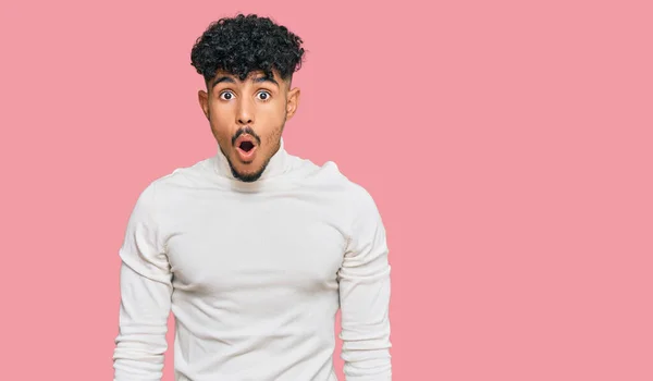 Young Arab Man Wearing Casual Winter Sweater Afraid Shocked Surprise — Stock Photo, Image