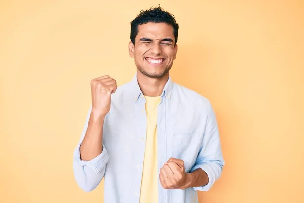 Young Handsome Hispanic Man Standing Yellow Background Celebrating Surprised Amazed — Stock Photo, Image