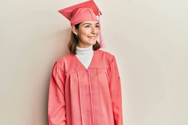 Young Caucasian Woman Wearing Graduation Cap Ceremony Robe Looking Away — Stok fotoğraf