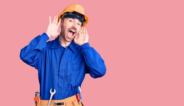 Young Hispanic Man Wearing Worker Uniform Smiling Cheerful Playing Peek — Stock Photo, Image
