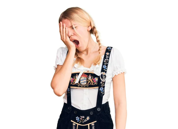 Young Beautiful Blonde Woman Wearing Oktoberfest Dress Yawning Tired Covering — Stockfoto