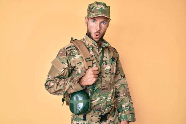 Young Caucasian Man Wearing Camouflage Army Uniform Canteen Scared Amazed — ストック写真