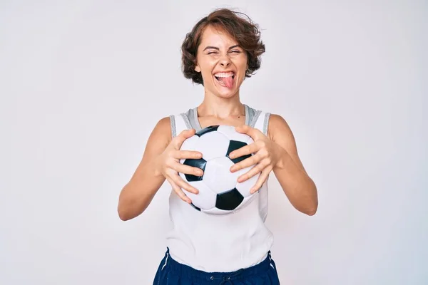 Jeune Femme Hispanique Tenant Ballon Football Langue Collante Heureux Avec — Photo