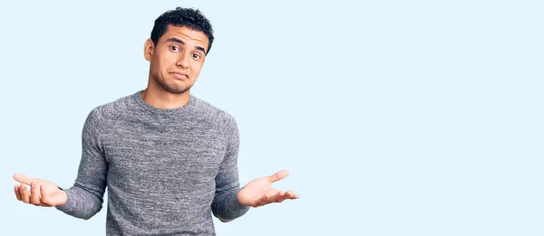Hispanic Handsome Young Man Wearing Casual Sweater Clueless Confused Expression — Stock Photo, Image