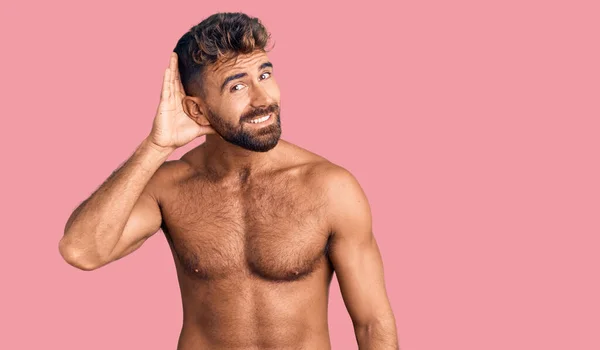 Young Hispanic Man Wearing Swimwear Shirtless Smiling Hand Ear Listening — Stock Photo, Image