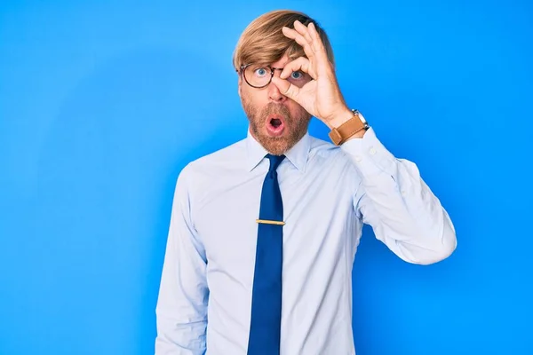 Young Blond Man Wearing Business Clothes Glasses Doing Gesture Shocked — Zdjęcie stockowe