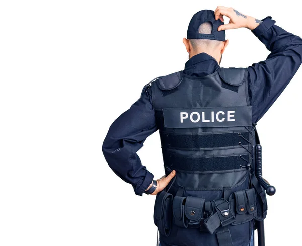 Jonge Knappe Man Draagt Politie Uniform Achterstevoren Denken Twijfel Met — Stockfoto