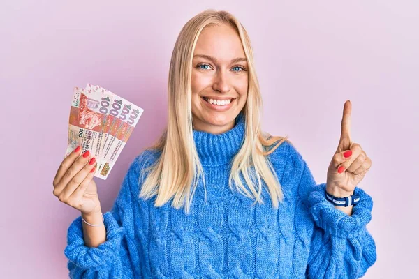 Young Blonde Girl Holding Hong Kong Dollars Banknotes Smiling Idea — Foto de Stock