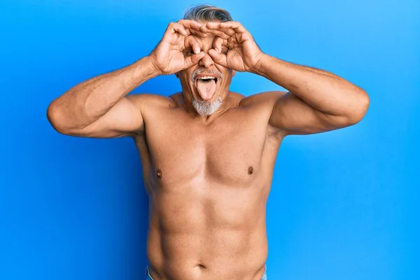 Middle Age Grey Haired Man Standing Shirtless Doing Gesture Binoculars — Stock Photo, Image