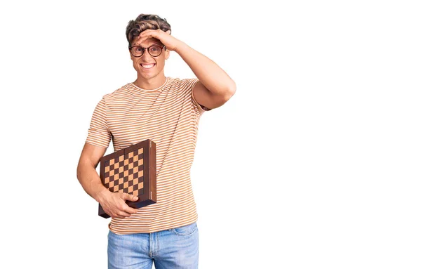 Young Handsome Man Holding Chess Stressed Frustrated Hand Head Surprised — Stock Photo, Image