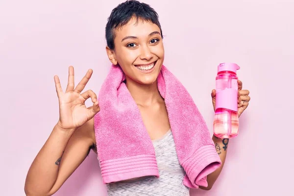 Young Woman Wearing Sportswearholding Water Bottle Doing Sign Fingers Smiling — 图库照片