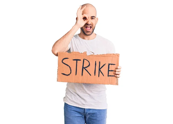 Young Handsome Man Holding Strike Banner Smiling Happy Doing Sign — Stock Photo, Image