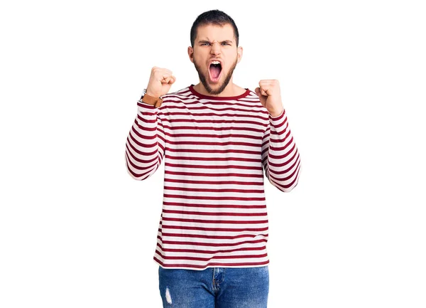 Young Handsome Man Wearing Striped Sweater Angry Mad Raising Fists — Stock Photo, Image