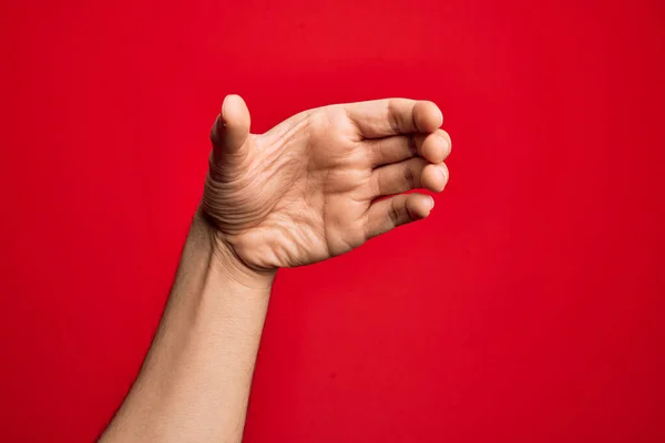 Hand Caucasian Young Man Showing Fingers Isolated Red Background Holding — Stock Photo, Image