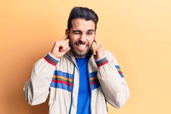 Young Handsome Man Beard Wearing Casual Jacket Covering Ears Fingers — Stock Photo, Image