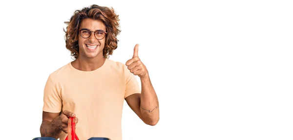 Young Hispanic Man Holding Supermarket Shopping Basket Smiling Happy Positive — 图库照片