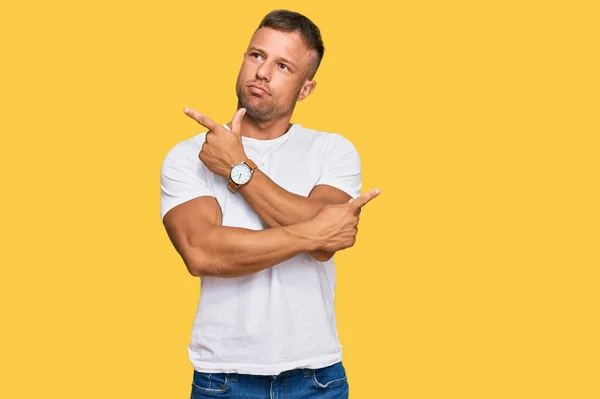Handsome Muscle Man Wearing Casual White Tshirt Pointing Both Sides — Stock Photo, Image