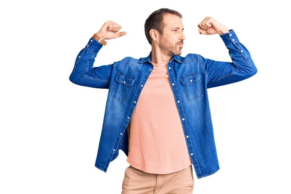 Young Handsome Man Wearing Casual Clothes Showing Arms Muscles Smiling — Stock Photo, Image