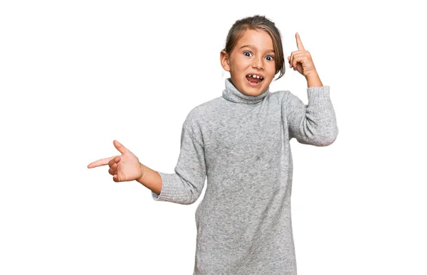 Little Beautiful Girl Wearing Casual Turtleneck Sweater Pointing Finger Successful — Stock Photo, Image